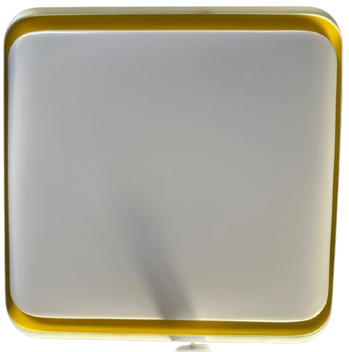 A modern LED ceiling lamp with a white surface and orange accents, with a visible LED strip and a remote control.